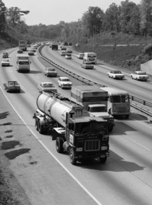 1960s TANKER TRUCK TRAVELING ON BUSY EXPRESSWAY 177519
