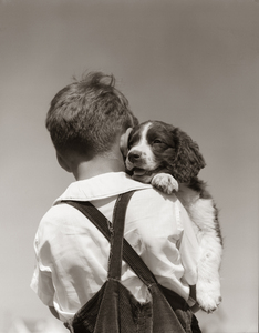 1940s BOY IN CORDUROY OVERALLS HOLDING A PUPPY 186592