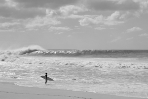 Surfer standing on the beach Oahu Hawaii USA 204351
