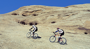 2 Men mountain bilking Slickrock Trail Moab UT 255853