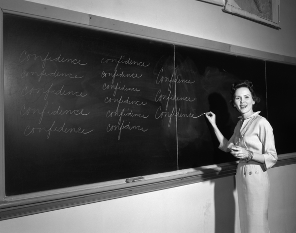 1950s TEACHERFRONT OF CLASS WRITING ON BLACKBOARD 172467 by Panoramic Images