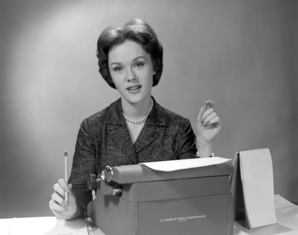 1960s SECRETARY SEATED BEHIND TYPEWRITER WITH PAD 195037 Print