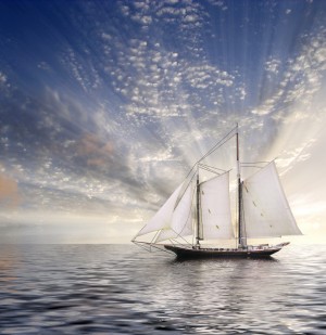Sailboat in calm water. Sunrise