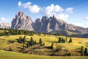 Seiser Alm and Sassolungo mountains in Dolomites