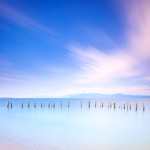 Fishing poles on the lake. Long exposure