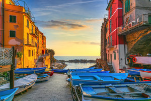 Riomaggiore village boats in street. Cinque Terre Italy.