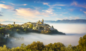 The picturesque village of Trevi on a foggy morning. Umbria Italy.