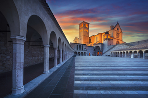Basilica of Saint Francis of Assisi at sunset. Umbria Italy.