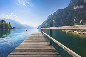 Wooden pier on the lake. Riva del Garda. Italy
