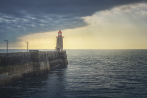Pier and lighthouse in Fecamp harbor. Normandy France
