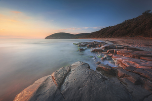 Sunset over Cala Violina beach in Tuscany