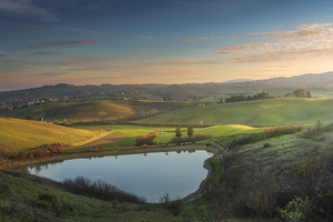Lake and rolling hills in Tuscany