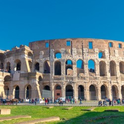The Colosseum a famous landmark of ancient rome under a sunny sky.