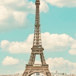 The Eiffel Tower gracefully rises above Paris a timeless symbol of romance and culture.