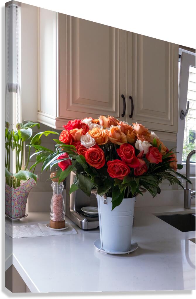 Bouquet of beautiful roses on the marble table in a kitchen Canvas Print