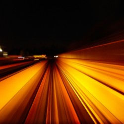 Vancouver Skytrain rapid transit rushing through the night