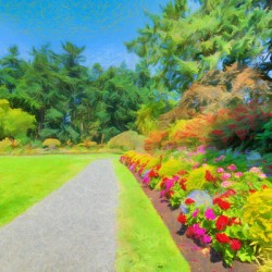 Green wide open meadow in a park with paved pathway. Pastel