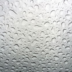 Abstract texture of water drops on a glass