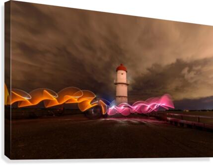 Dramatic light house Canvas Print