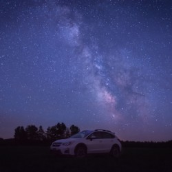 Milky Way over white car
