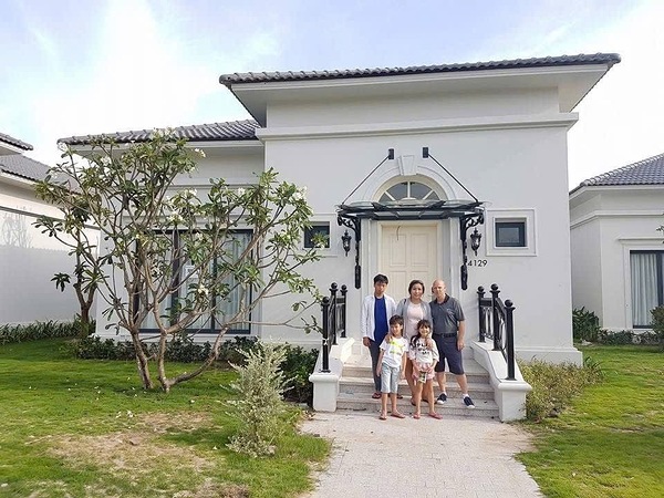 A Family Moment in Front of Their Villa by CHANEL