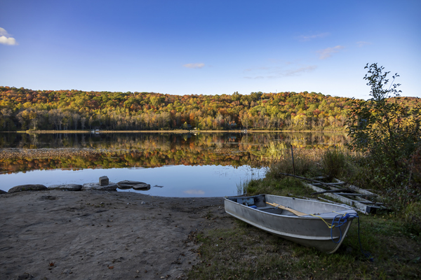 Rowboat by a Lake in an Autumn Forest by JRT Photography