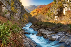 mountain river and stream among high stone cliffs