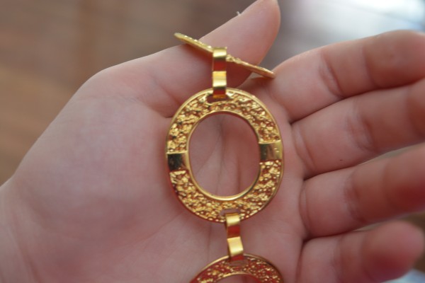 Golden necklace by Cassandra Lewis