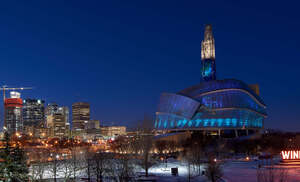 Winnipeg Human Rights museum lit with Northern lights