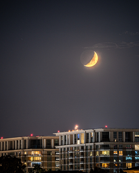 Waxing Crescent Moon Over the City by David Yoon