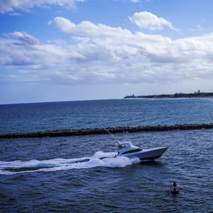 Running Fast SQUARE   Boats and Beautiful Skies Singer Island Florida
