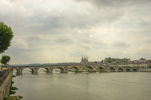Bridge over the Loire in Blois France with Saint Nicholas Cathedral and the Royal Chateau