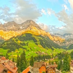 Golden Rays Across The Bernese Highlands in Switzerland Panorama with Engstligen Falls