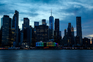Beautiful Manhattan downtown with dramatic sky at sunset