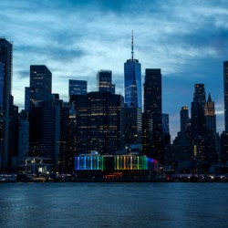 Beautiful Manhattan downtown with dramatic sky at sunset