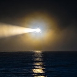 Dramatic beacon over the ocean 1