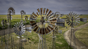 WINDMILLS AND STORMY SKIES