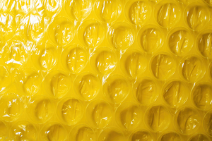 Yellow bubble wrap plastic material   packing supplies for diverse household