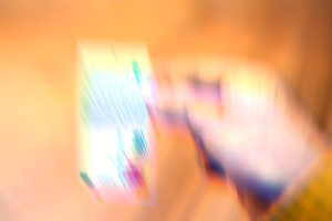 Blurred Hand Holding a Vibrant Object