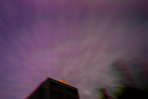 Blurred Hotel Sign at Night with Purple Sky