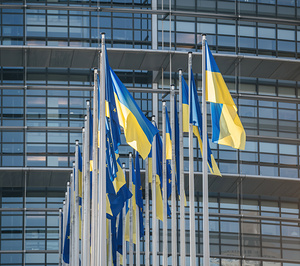 The Ukrainian flag flies next to the Flag of Europe