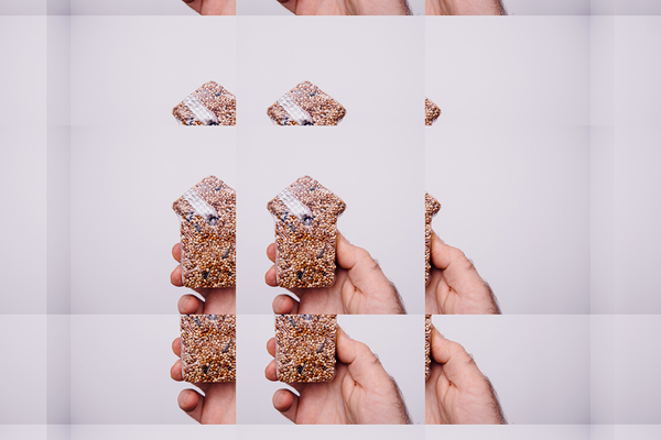 Hand Holding Seed Snack with Repetitive Pattern Print