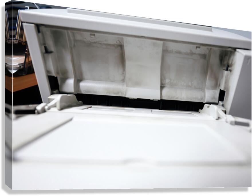 Dirty with printing dust from toner open paper tray on the vintage laser printer Canvas Print