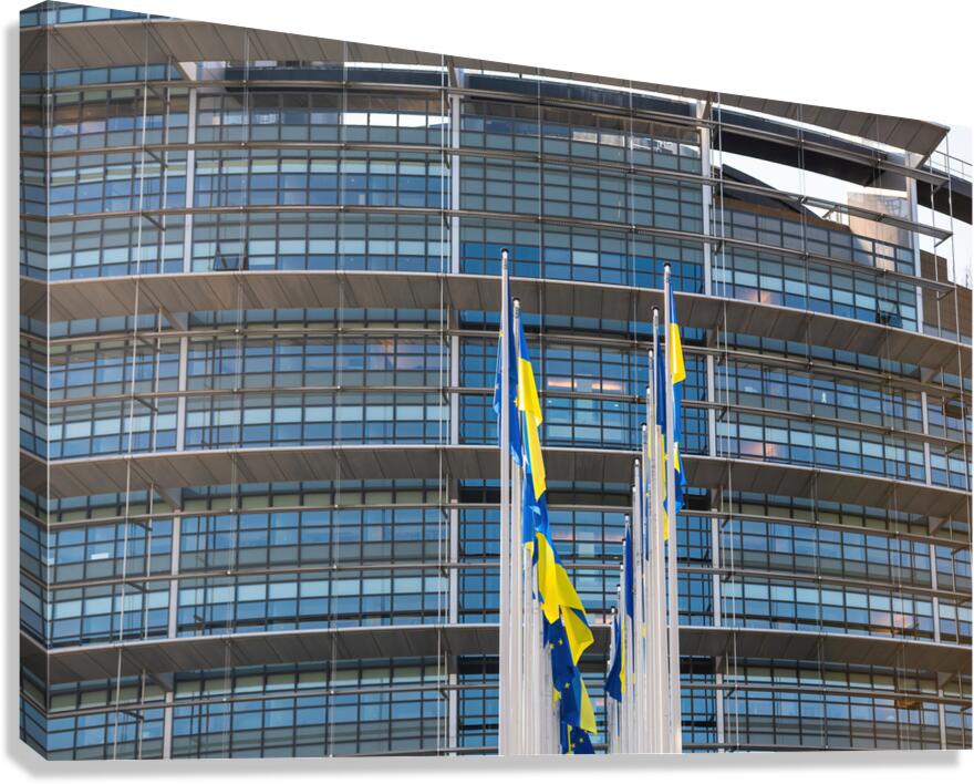 Front view of Ukrainian flag flies next to the Flag of Europe in front of Parliament building Canvas Print