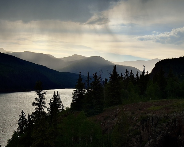 Rainy sunset over the reservoir by Dick Davis