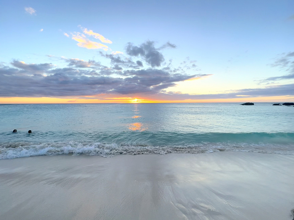 Two lovers drifting in Kua Bay by Angelia M Baxter