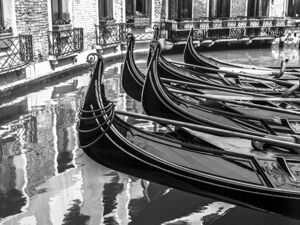 Gondolas in narrow canal Venice Italy