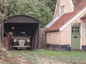 Classic Car in Garage of Old House