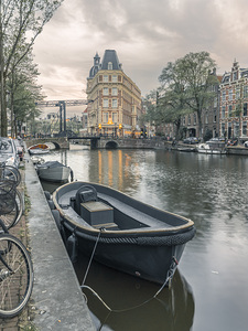 Boat moored by the canal Amsterdam