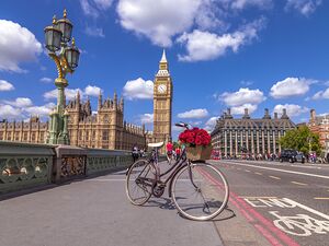 Bicycle with bunch of flowers on Westminster Bridge London UK